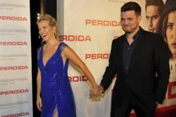 Michael Buble and pregnant wife Luisana Lopilato pose for photos at "Perdida" premiere
