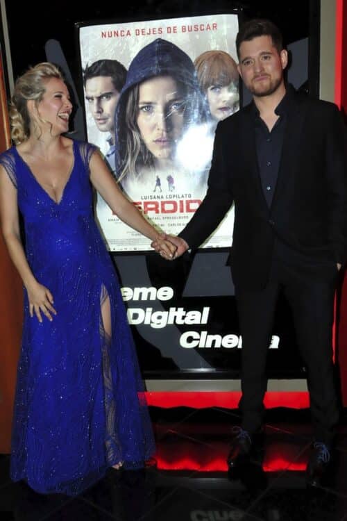 Michael Buble and pregnant wife Luisana Lopilato pose for photos at "Perdida" premiere