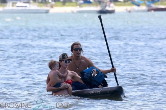 Very pregnant Candice Swanepoel and Hermann Nicoli at the beach with their son