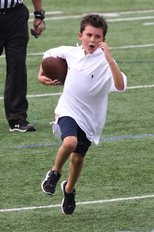 Benjamin Brady running the ball at dad Tom Brady's Best Buddies Charity Event