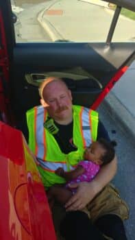 Firefighter Hailed As Hero For Cuddling Baby At Accident Scene