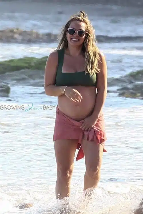 Pregnant Hilary Duff shows off her baby bump at the beach
