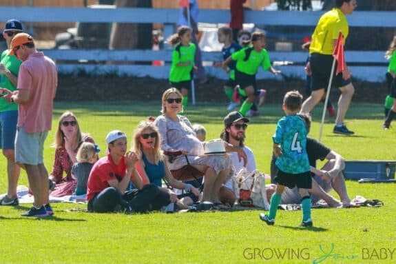 A heavily pregnant Kate Hudson and partner Danny Fujikawa take her son Bingham to soccer practice in Malibu with mom Goldie and son Ryder