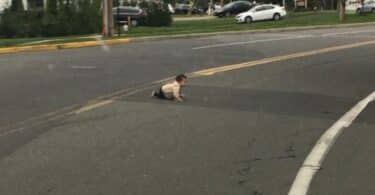 baby crawling across Joe Parker Road in Lakewood