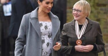 Meghan Markle shows off growing baby bump while making a visit to the Royal Variety care home f