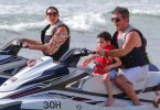 Simon Cowell and his partner Lauren Silverman and son Eric Cowell enjoy an afternoon on jet skis in Barbados