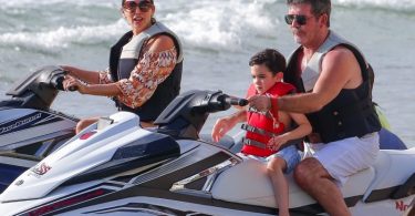 Simon Cowell and his partner Lauren Silverman and son Eric Cowell enjoy an afternoon on jet skis in Barbados