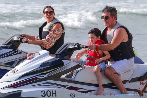 Simon Cowell and his partner Lauren Silverman and son Eric Cowell enjoy an afternoon on jet skis in Barbados