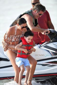 Simon Cowell and his partner Lauren Silverman and son Eric Cowell enjoy an afternoon on jet skis in Barbados