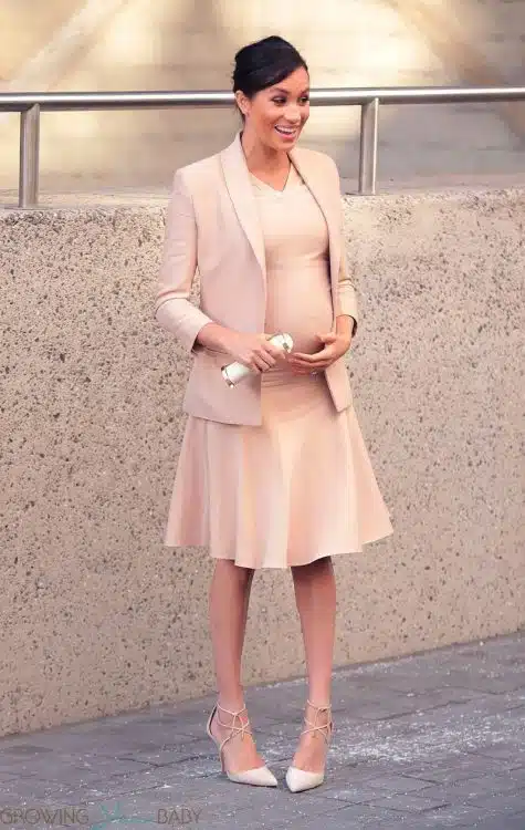 Pregnant Meghan Markle, Duchess of Sussex shows off her baby bump at the National Theatre in London