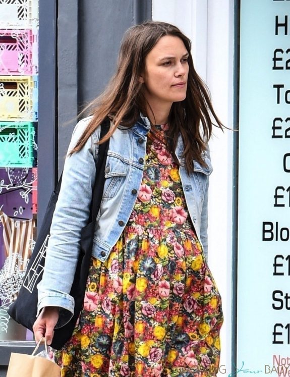 Pregnant Keira Knightley shows off her baby bump while wearing a floral dress out in London