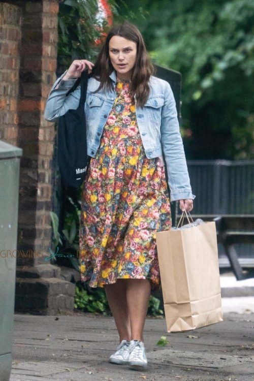 Pregnant Keira Knightley shows off her baby bump while wearing a floral dress out in London