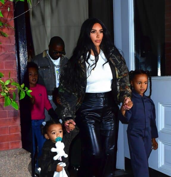  Kim Kardashian and Kanye West head to his album release party with their kids