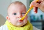 baby eating cereal