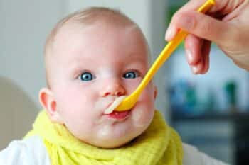 baby eating cereal