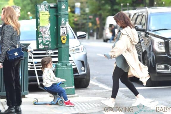 Pregnant Anne Hathaway cradles her growing baby bump in NYC