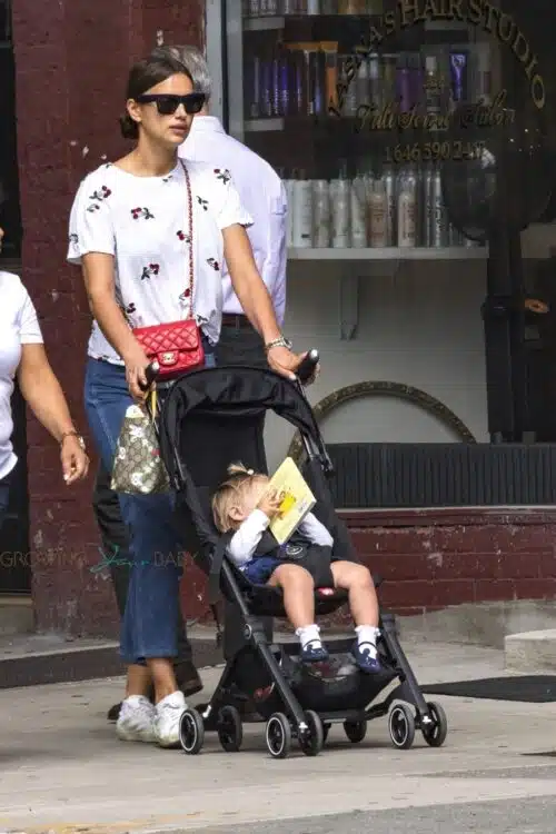 Irina Shayk is back to mommy duties out with her red Chanel handbag and daughter Lea
