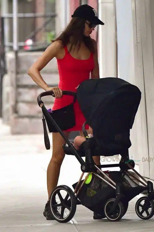 Irina Shayk wears a red mini dress on an outing with her daughter Lea