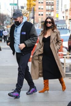 Emily Ratajkowski looks stylish in a trench coat as she shows off her growing baby bump while out in NYC