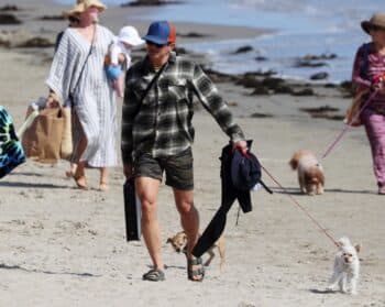 Pop star Katy Perry and husband Orlando Bloom walk with their baby Daisy Dove on the beach in Santa Barbara