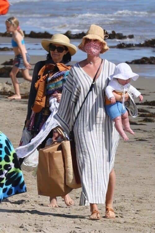 Pop star Katy Perry walks with her baby Daisy Dove on the beach in Santa Barbara