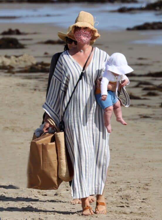 Pop star Katy Perry walks with her baby Daisy Dove on the beach in Santa Barbara