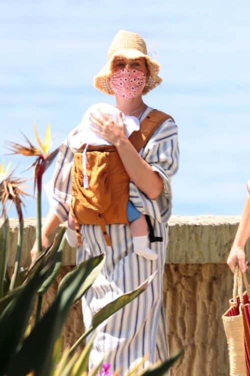 Pop star Katy Perry walks with her baby Daisy Dove on the beach in Santa Barbara