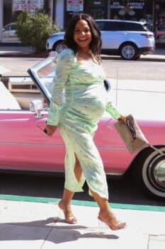 Pregnant Christina Milian poses for pictures at the grand opening of her Beignet Box Cafe in LA