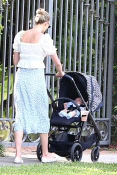 Karlie Kloss goes out for a walk with her newborn baby boy Levi Joseph