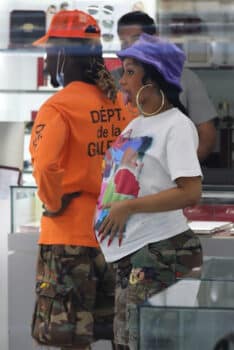 Cardi B shows off her growing baby bump as she shops for new sunglasses with Offset.