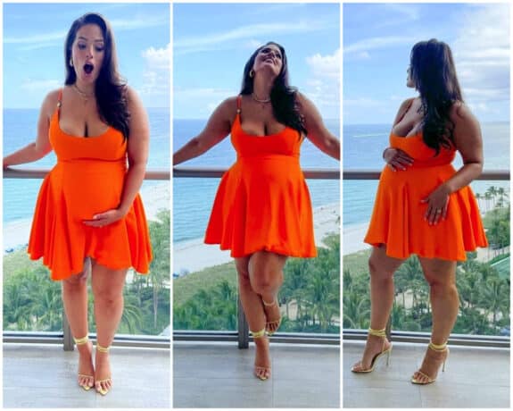 Pregnant Ashley Graham poses on her hotel balcony in Miami