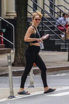 Pregnant Jennifer Lawrence bares her growing baby bump while out for a walk in manhattan