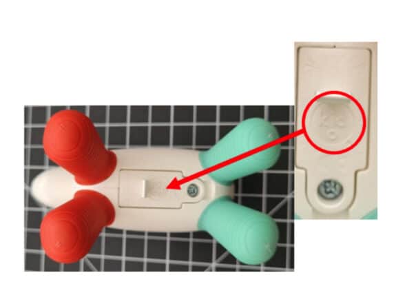 Kid O printed on the battery cover of the recalled Hudson Glow Rattle