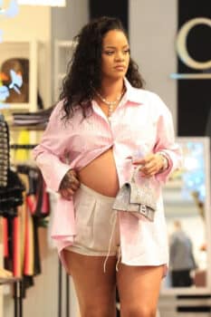 Pregnant Rihanna shows a peak of her growing belly while shopping for baby clothes