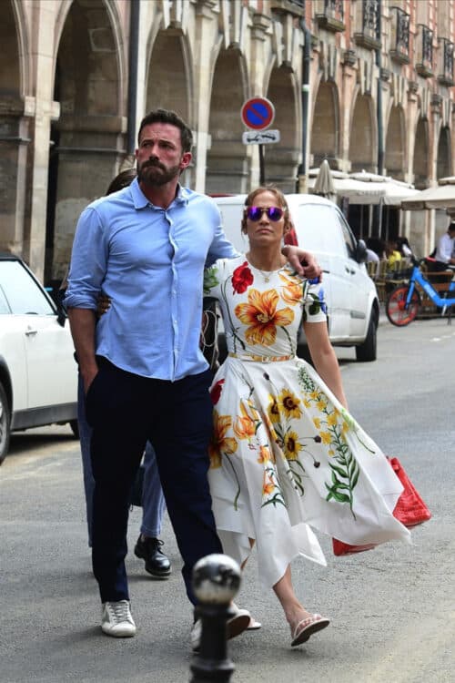 couple walking down the street in paris