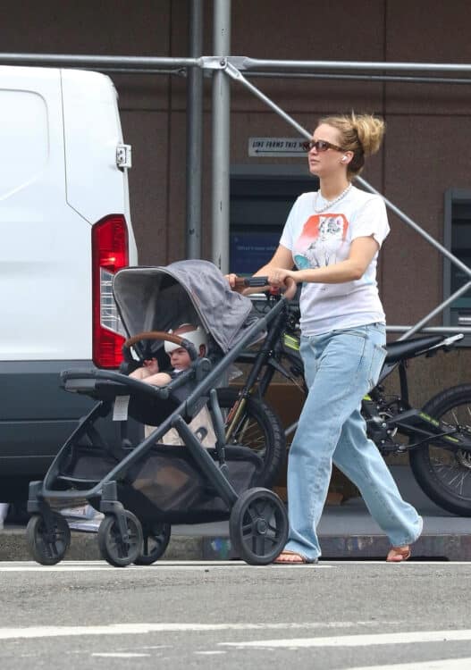Jennifer Lawrence takes her newborn for a stroll through the city