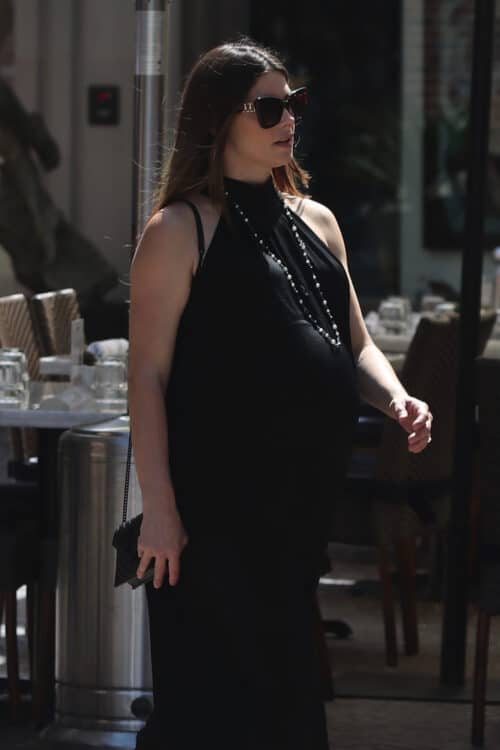 pregnant ashley greene wearing black dress crossing the street
