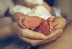 baby feet in a moms hands