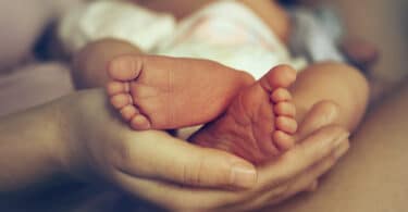 baby feet in a moms hands