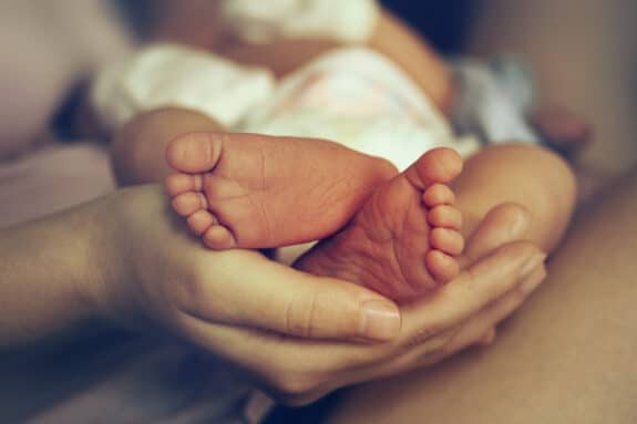 baby  feet in a moms hands