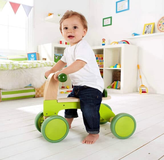 green wooden ride on for toddlers