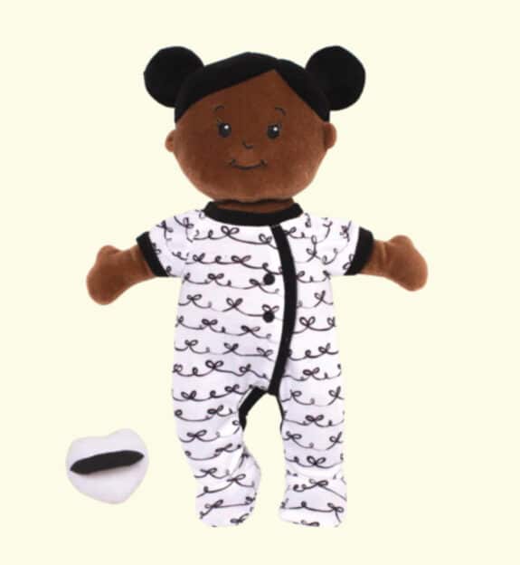 brown baby doll with black buns in her hair 