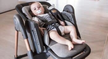 Baby laying in Maxi-Cosi Minla 6-In-1 High Chair