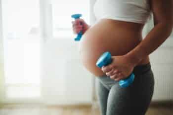 Pregnant woman taking care of her body during pregnancy