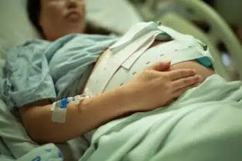 pregnant woman being monitored in the hospital