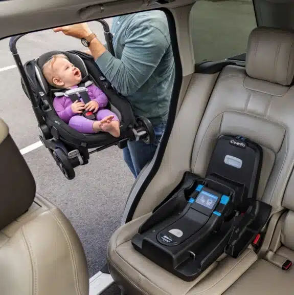 baby getting into the car Evenflo Shyft DualRide with Carryall Storage Infant Car Seat and Stroller Combo
