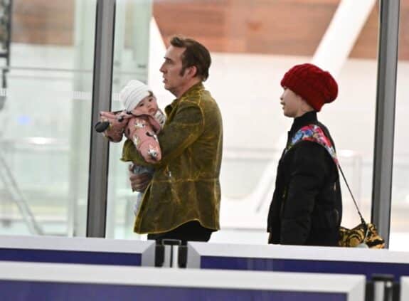 Nicolas Cage arrives at JFK airport with his wife Riko Shibata and daughter
