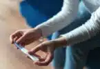 woman holding a pregnancy test