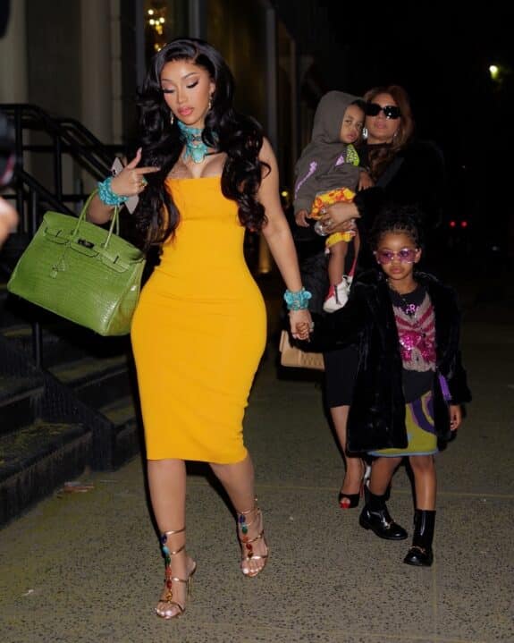 cardi b dressed in yellow walks with her kids and mom after leaving dinner