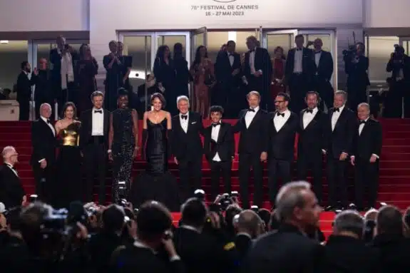 Indiana Jones and the Dial of Destiny cast descends the steps at the 76th Cannes International Film Festival